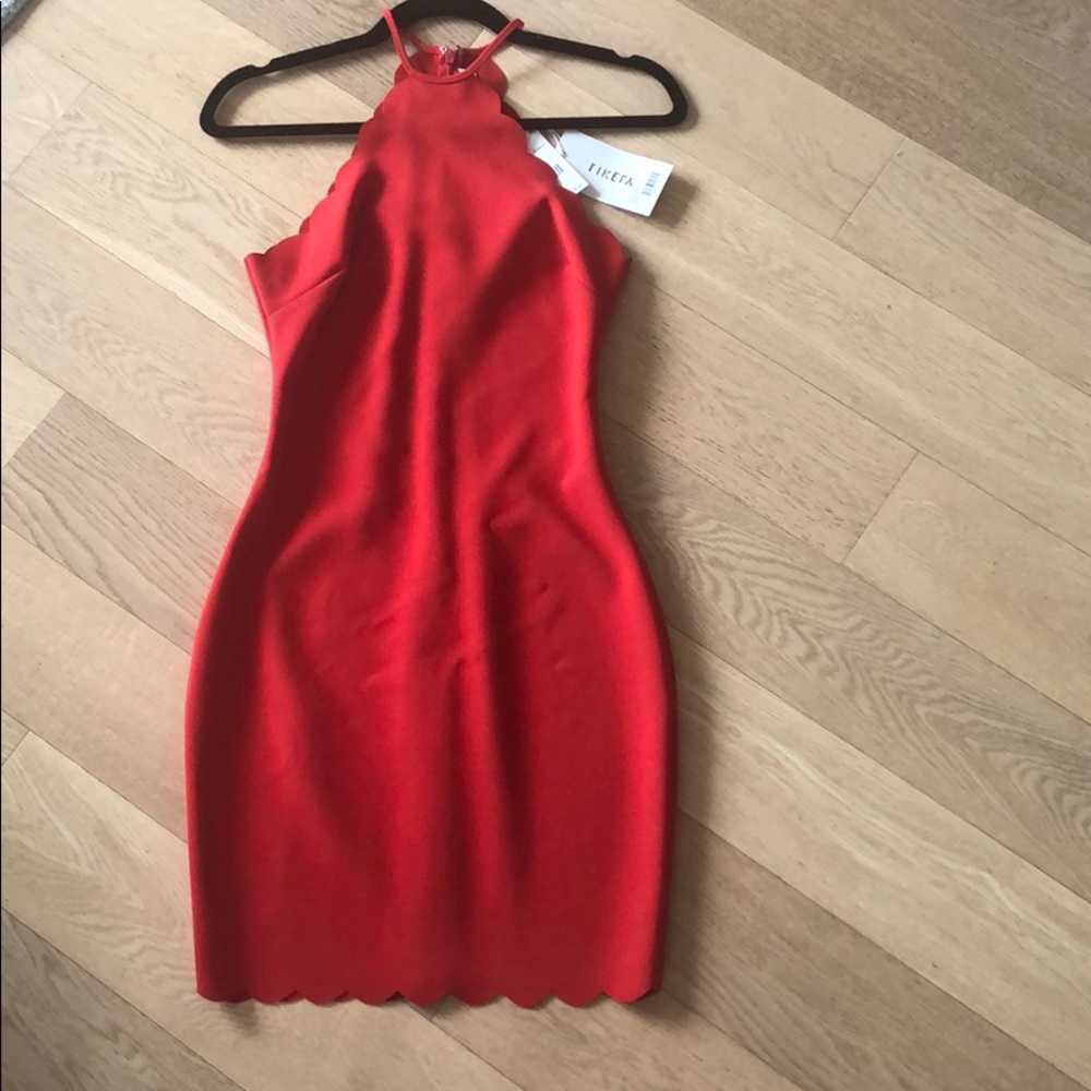 Likely red dress with scalloped design